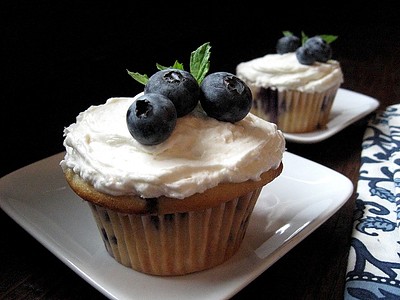Photo of a delicious blueberry bourbon cupcake.